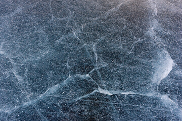 Beautiful ice of Lake Baikal with abstract cracks