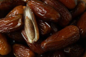 Tasty dates fruits on whole background, close up