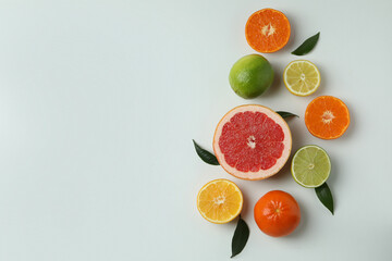Fototapeta na wymiar Fresh citrus on white background, space for text