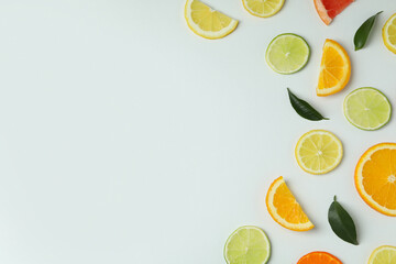 Fresh citrus slices on white background, space for text