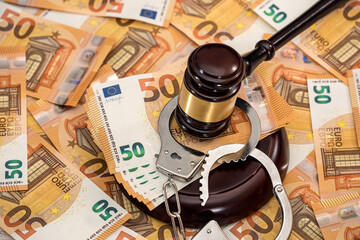 Handcuffs and euro banknotes