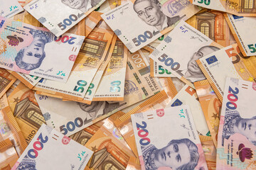 hrivna and euro bills as finance background