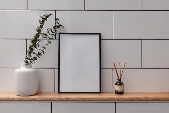 Frame mock-up in white minimal bathroom