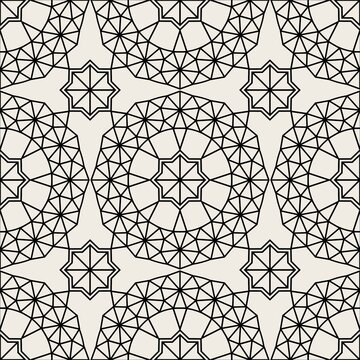 Elegant seamless geometric pattern in arabic style background with flowers and stars. Gold on black