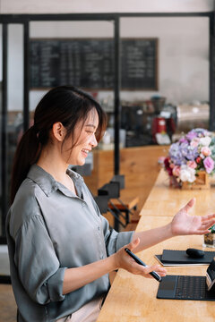 Video Call Communication Lead Asian Leader Talk To Colleagues Work From Home Office Wear Headphones At Virtual Meeting. Student Use Laptop And Internet E-learning Remotely