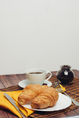 croissants in a plate on the table flour dessert coffee 
