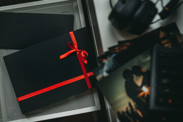 Black gift box with the red ribbon