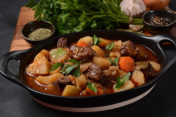 Irish stew made with beef, potatoes, carrots and herbs. Traditional St.Patrick's day dish, stewed in dark Guinness beer