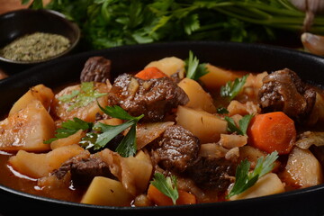 Irish stew made with beef, potatoes, carrots and herbs. Traditional St.Patrick's day dish, stewed in dark Guinness beer