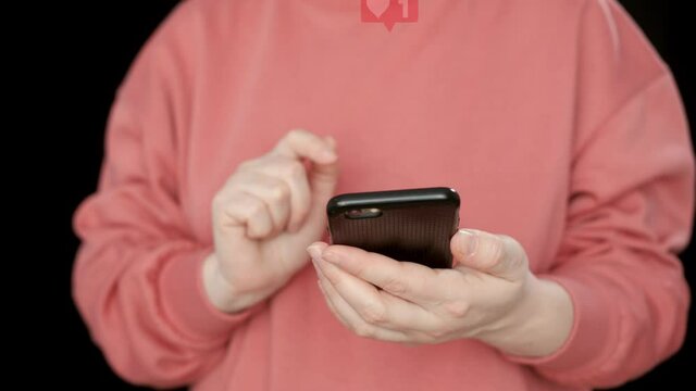 Female fingerpushing likee in social networks. Red heart with like on screen. Woman rating five red stars in internet voting