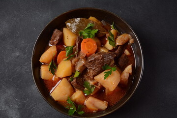 Irish stew made with beef, potatoes, carrots and herbs. Traditional St.Patrick's day dish, stewed in dark Guinness beer