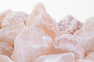 Himalayan rose salt for bath and sauna spa healthy habits with light background macro