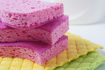Obraz na płótnie Canvas Pink cleaning sponges and multicolor micro Fiber cleaning cloths