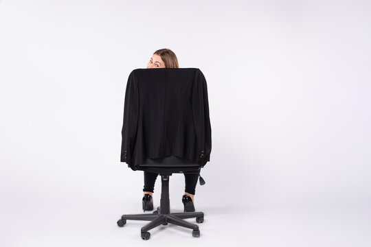 Workaholism, Mental Insanity Weird Job, Work Company Concept. Insane Office Woman At Work. Mad Secretary, Sly Expression Spying On You Through The Office Chair. Back View,grey Background,plenty Space