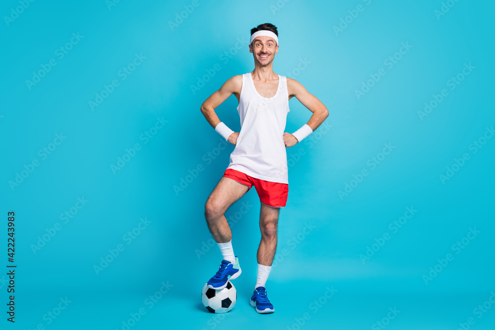 Sticker Full body photo of sporty man with foot ball final league player wear wristband shorts sneakers isolated blue color background