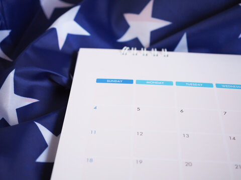 The 4th Day On A Calendar Page Over American Flag Backdrop..