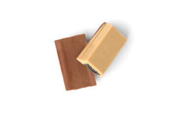 White chocolate bar with black waffle isolated on white background. Black wafer in white chocolate.