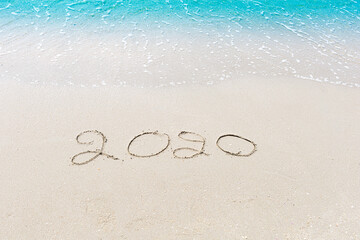 Happy New Year 2020 is coming concept sandy tropical ocean beach