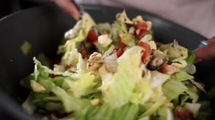 mix vegetable salad with seafood salad with a spoon