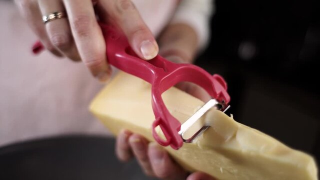 cut hard cheese into slices for salad