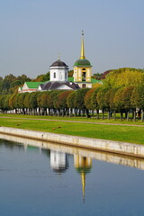 Church next to the pond in the park.