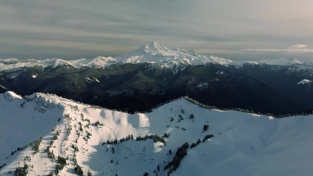 Helicopter Perspective of Mount Baker Peak in Snowy Washington Mountains