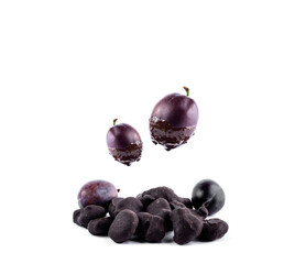 dried plum covered by dark chocolate, composition with  fresh fruits in dark chocolate isolated on white background. free space for text and logo.