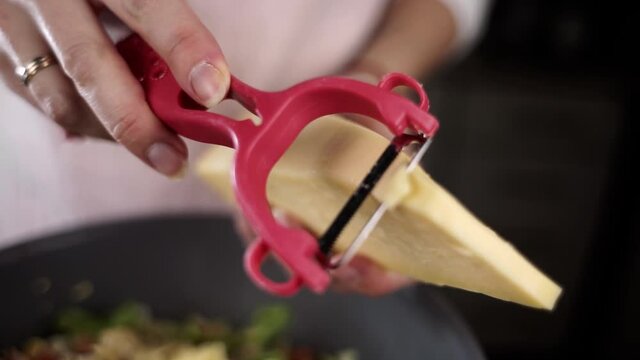cut hard cheese into slices for salad