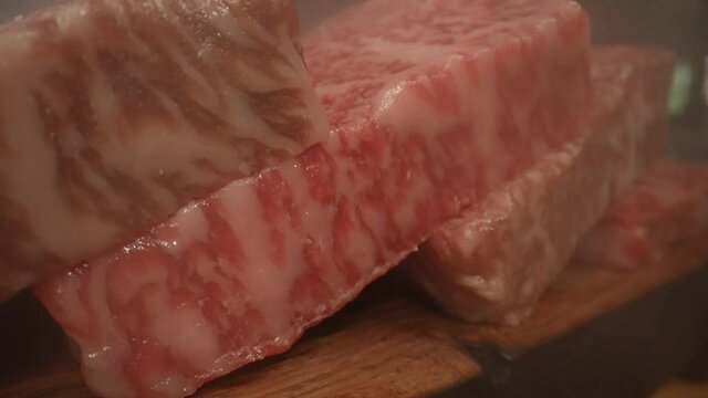 Close up on macro lens of wagyu testure meat. Wagyu is any of four Japanese breeds of beef cattle. In several areas of Japan