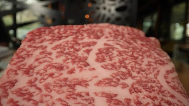 Close up on macro lens of wagyu testure meat. Wagyu is any of four Japanese breeds of beef cattle. In several areas of Japan