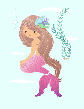 The mermaid smiles and looks ahead, sitting on the ground with seaweed in the background