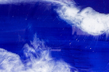 White smoke in dark deepness. Blue Alcoholic Ink. Cloud of ink. Abstract. White Stains. Sky Smearing. Water Delicate Liquid.