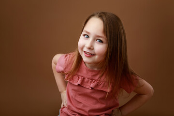 Portrait of smiling girl with funny gesture