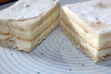 Snow White Cake (or Alba ca Zapada in Romanian language) traditional cake on a blue circled plate