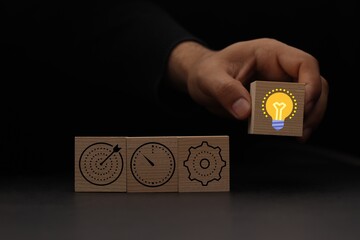 Concept of business strategy and action plan. Wood cube block stacking with icon