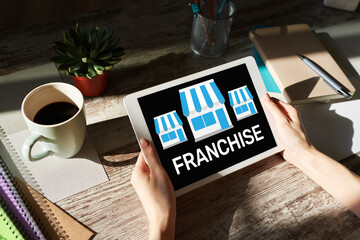 Franchise business model and growth concept on device screen