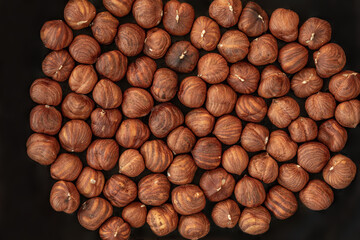 Hazelnuts heap as a Background. Top view. Flat lay. Hazel nuts Pattern.