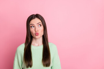 Fototapeta premium Portrait of attractive person kiss lips look empty space wear pullover isolated on pink color background