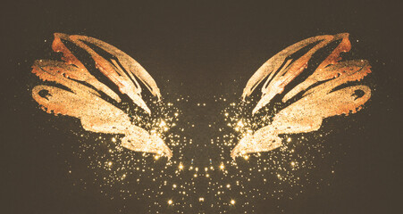 Golden glitter on abstract gold hand painted wings on black background