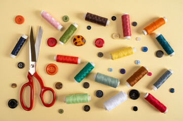 sewing accessories. sewing equipment on a yellow background