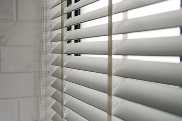 Close-up open venetian blinds. lighting range control sunlight coming from a window. decoration interior. Modern jalousie.