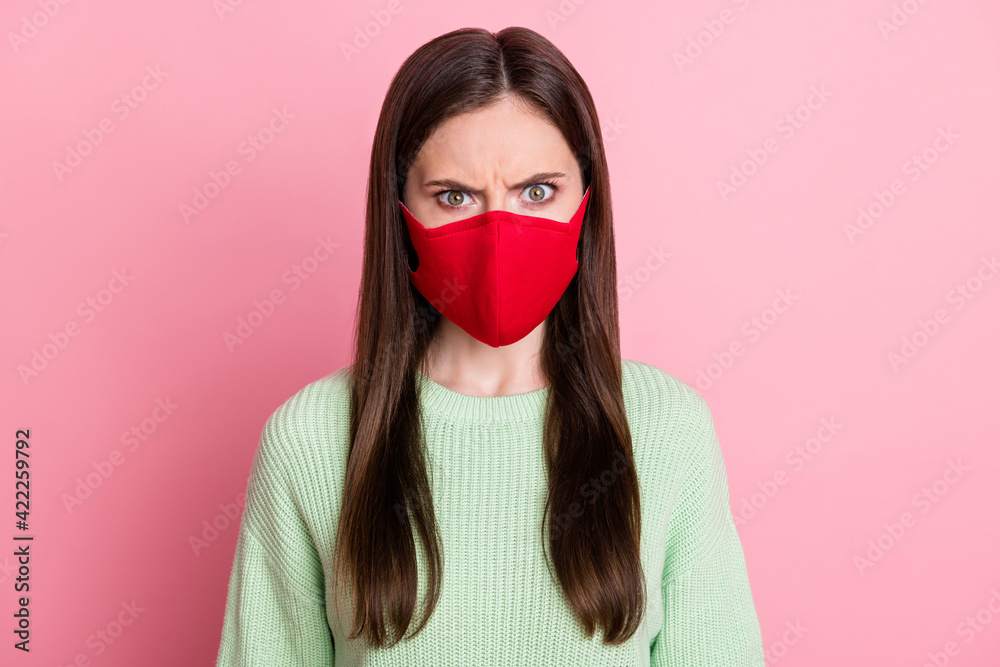 Poster Portrait of angry brunette girl wear face mask lime sweater isolated on pink color background