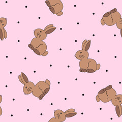 Seamless pattern of cute, adorable chocolate easter bunnies in a pastel, light pink background with black spots