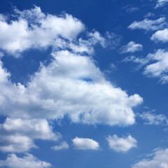 Naklejka na ściany i meble bizarre clouds against the blue sky. dragon or imagination