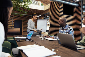 Businesswoman reading notes during a meeting