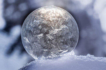 Close up frozen soap bubble with bokeh