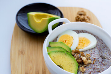 Flaxseed porridge with avocado and egg. Detox breakfast. Healthy anti-age porridge