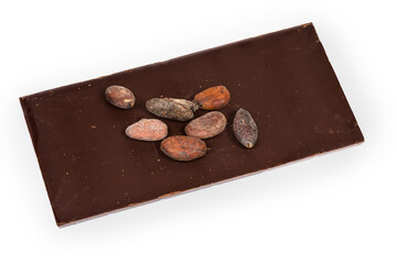 Dried cocoa beans on chocolate bar on a white background