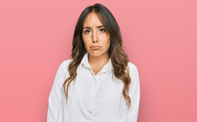 Young brunette woman wearing casual clothes depressed and worry for distress, crying angry and afraid. sad expression.