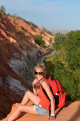 Young girl in the desert. Beautiful landscape in the valley